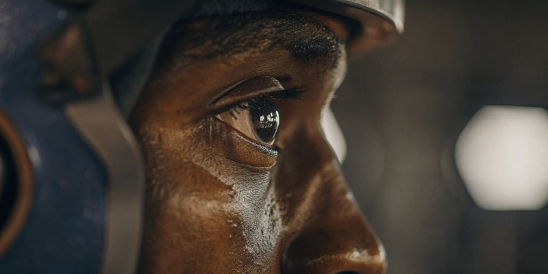 Athlete's focused eye and hand during coordination training.