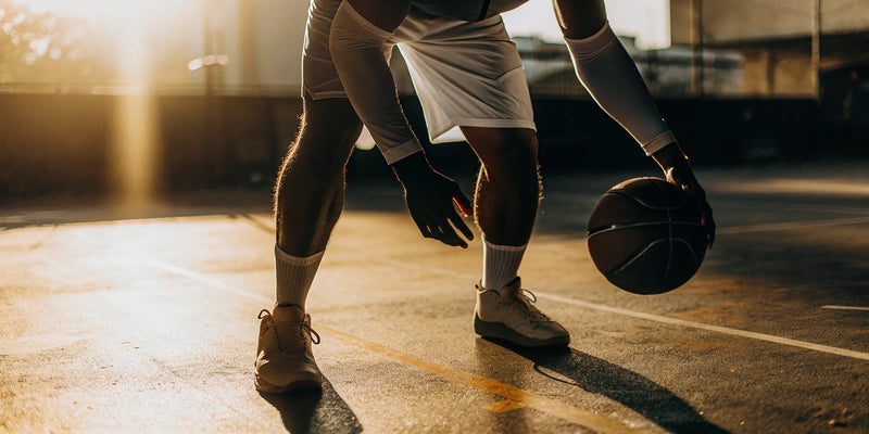 A player wearing the best basketball goggles for dribbling practice.