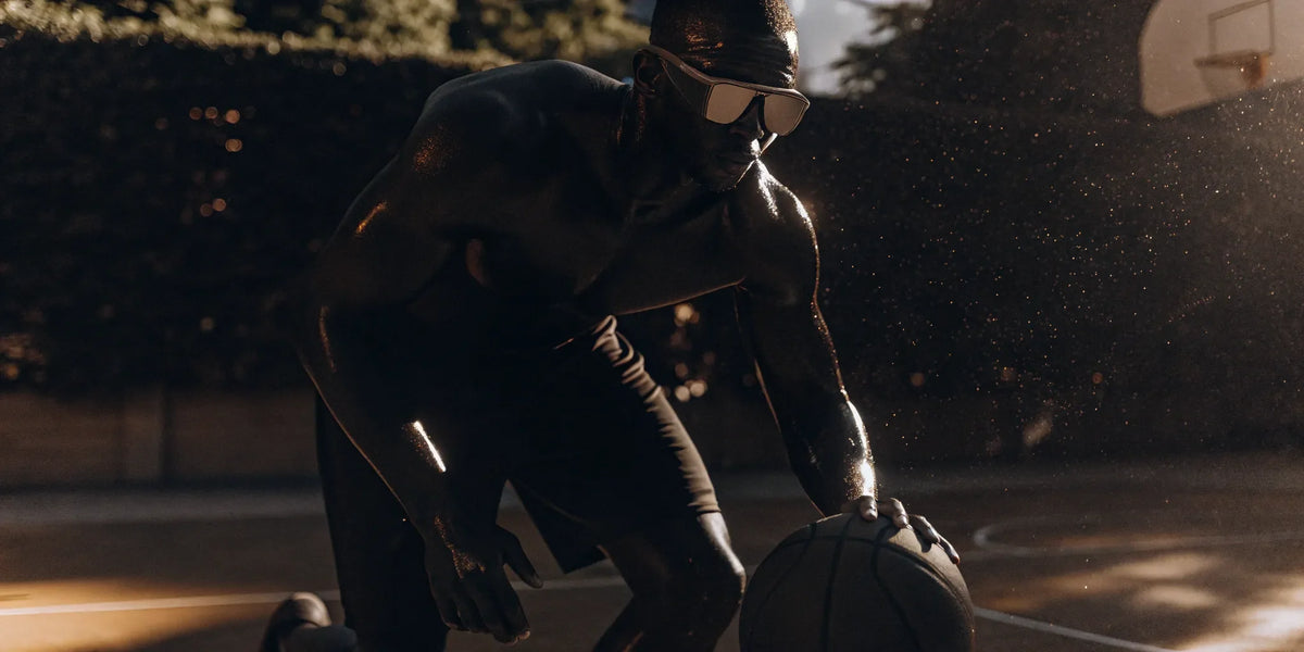 Basketball player wearing dribbling goggles, improving ball control and court vision.