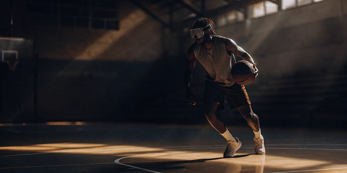 Basketball player improving their dribble with Dribble Master training goggles.