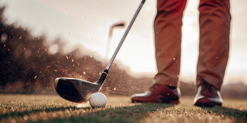 A golfer watches their shot, using ball tracking tips for game improvement.