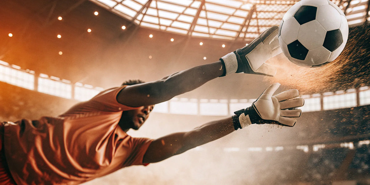 Goalkeeper deflecting ball with training deflector.