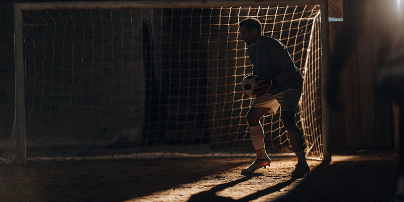 A focused goalie trains with a ball to improve vision and hand-eye coordination.