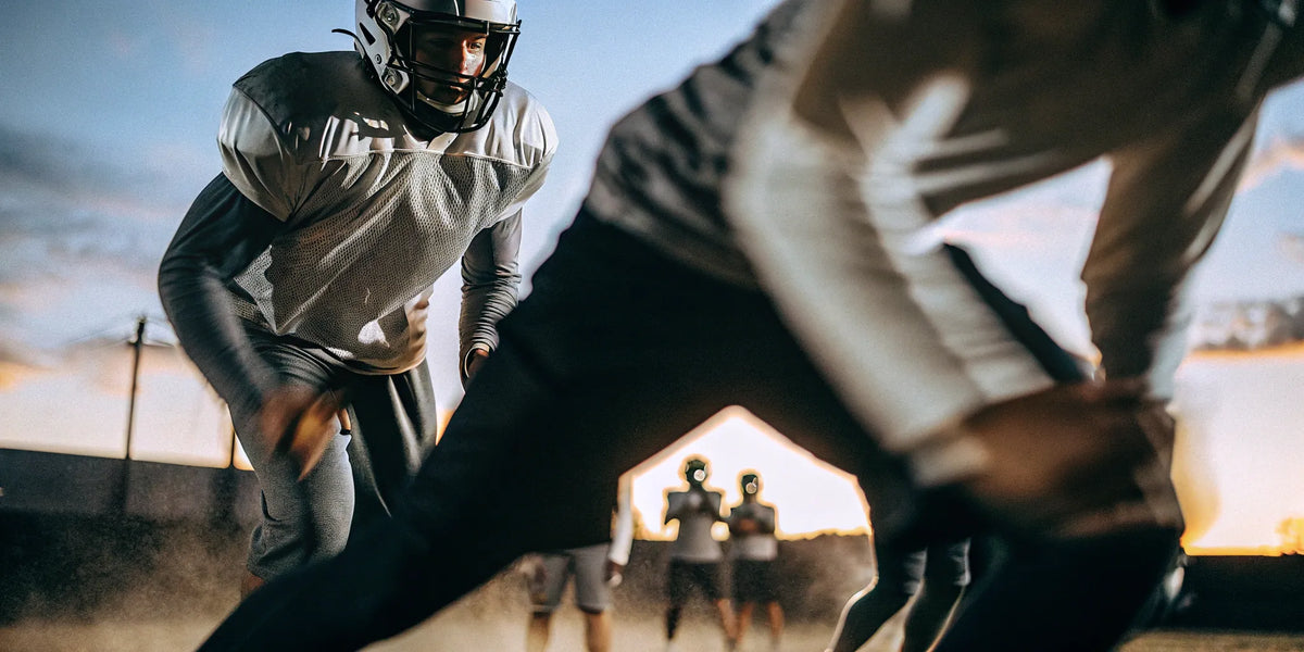 An athlete demonstrates a good reaction time during a football training drill.